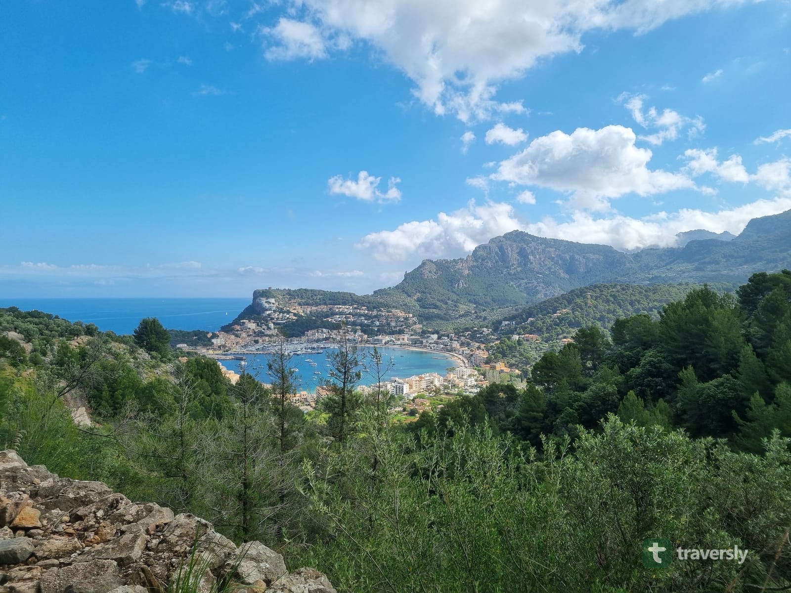 The view over Port de Sóller's bay and old town from the trail above, with the Tramuntana mountains behind.